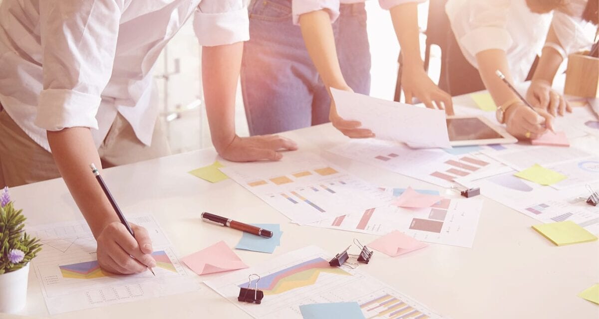 Group of people looking at documents