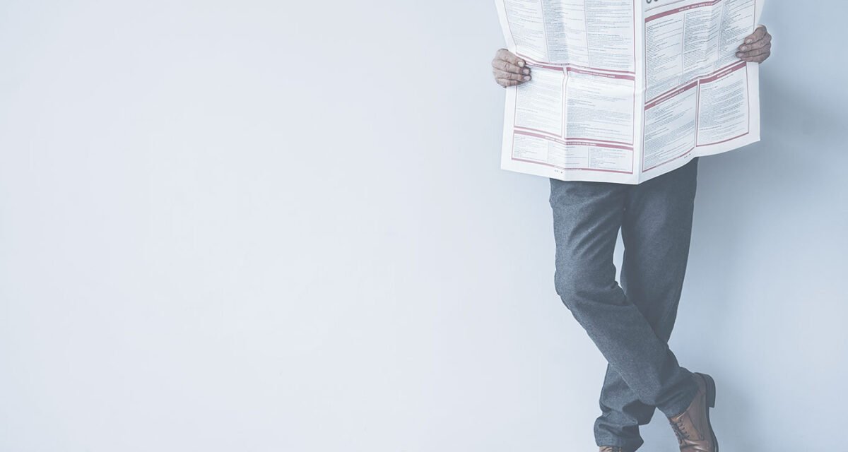 Men reading newspaper