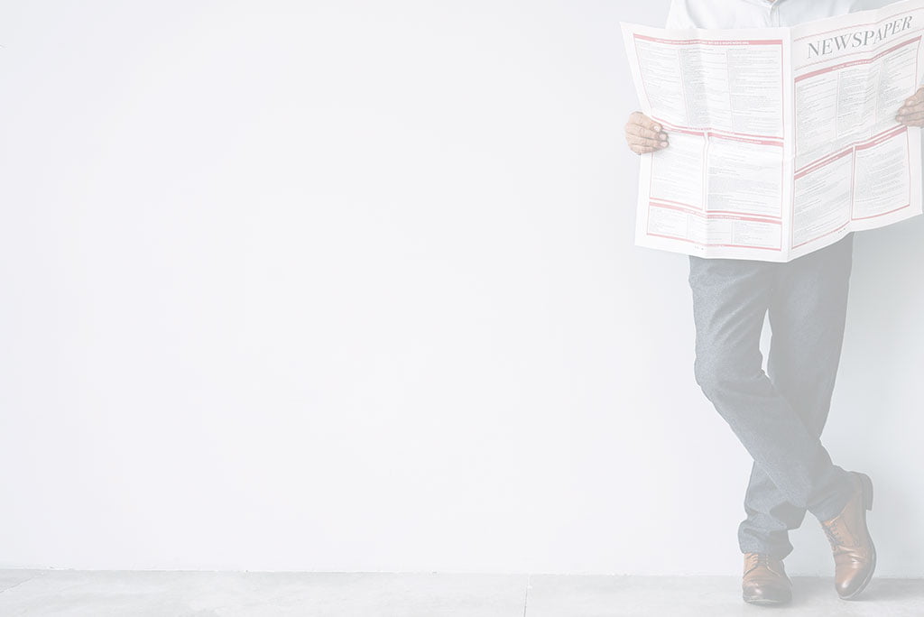 Person holding newspaper