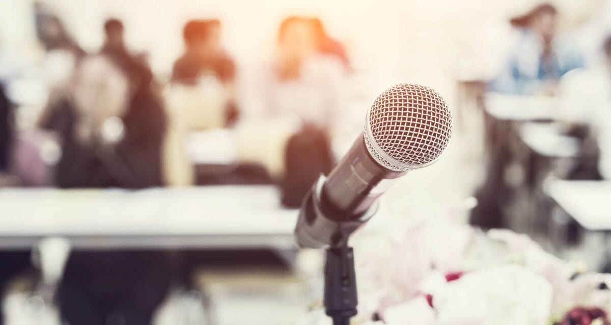 Microphone in front of the group of people