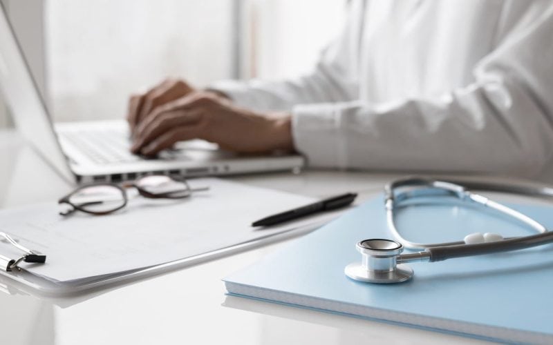 Doctor working on computer