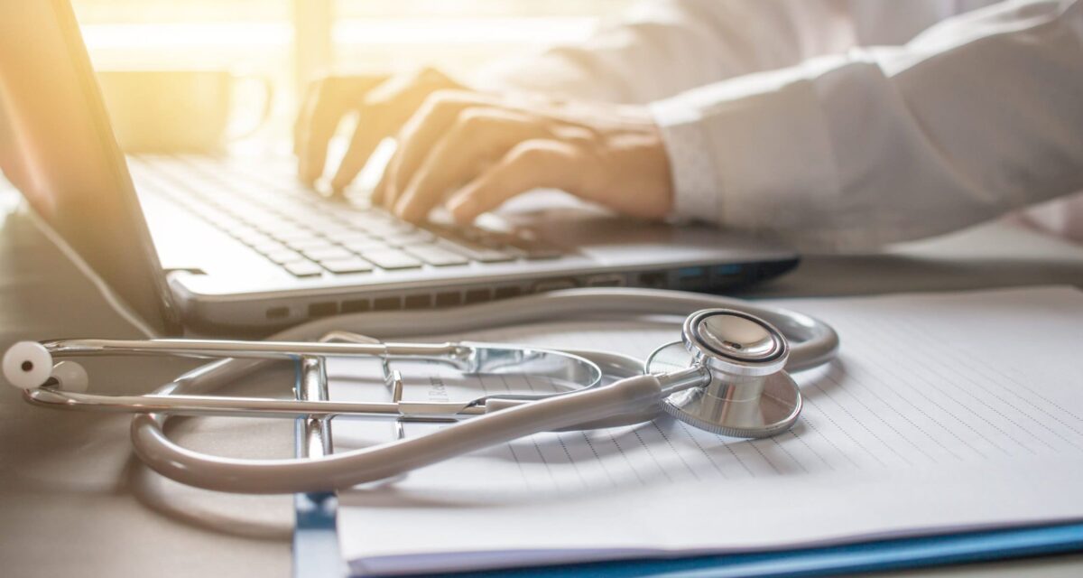 Stethoscope on prescription clipboard and Doctor
